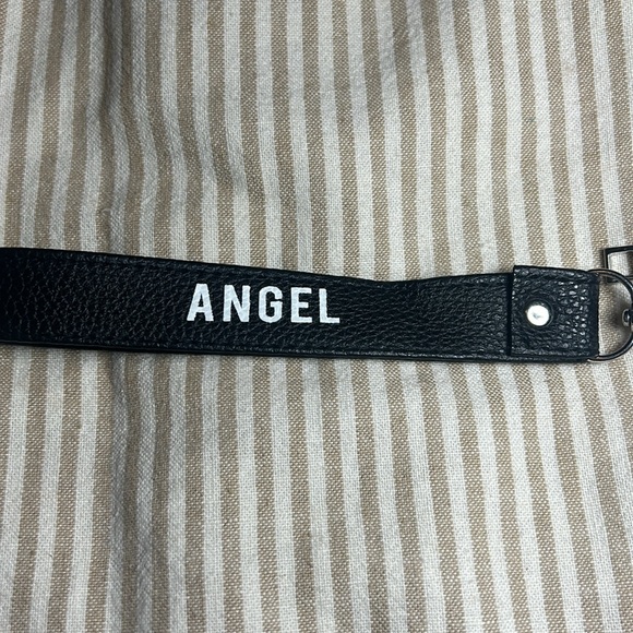 White wallet with butterfly on it. - Picture 2 of 4